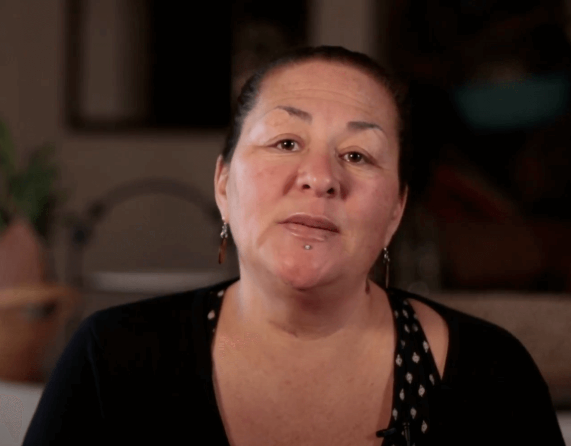 Woman explaining the benefits of free tax filing.
